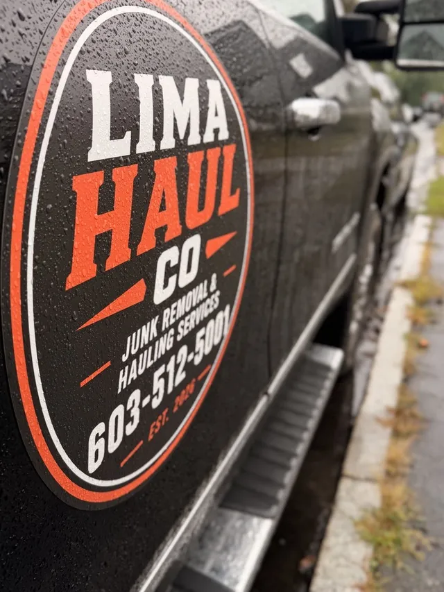 Close-up of the Lima Haul Co. logo decal on the black company truck