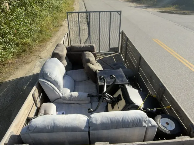 Lima Haul Co. utility trailer loaded with couches and furniture ready for haul-away
